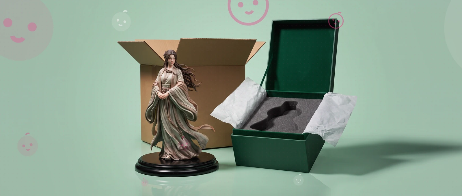 A figurine beside its shipping carton and its open gift box.